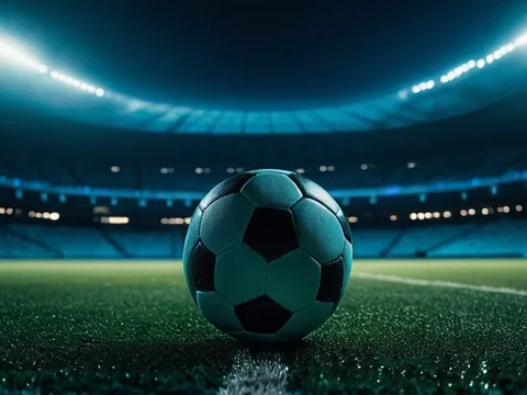 Football on the AllPanel deck &mdash; a football on a floodlit stadium pitch